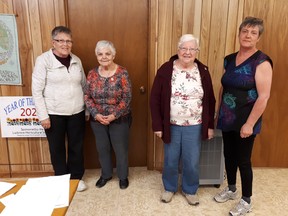 Life memberships are presented to Ruth Alton and Loreen Alton (centre), by Elizabeth Irwin (L) and Sharon Nivins (R). SUBMITTED