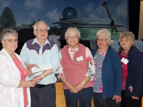 At the end of the tournament, (l-r) Kathy Faoro presented second place to home team members Wayne Prier, Toni Meyer, Dolly Gates and Donna Prier.