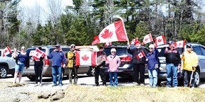 Photo by KEVIN McSHEFFREYA group of Elliot Lake residents celebrated freedom in Canada by having a rally down to Highway 17 on April 30.