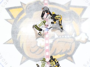 Liam Arnsby of the North Bay Battalion and Jan Mysak of the Hamilton Bulldogs get the Ontario Hockey League's Eastern Conference final underway Friday night at FirstOntario Centre. Game 2 of the best-of-seven series goes Sunday night at Hamilton.
