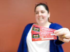 Area resident Ardis Chedore scooped up the first tickets for this year's Summerfest. She along with others who bought tickets will be able to enjoy the festivities this weekend.