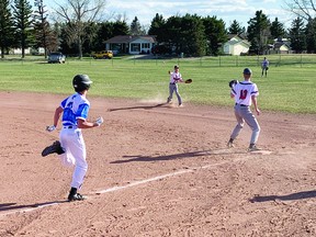 Knights second baseman Rhylen Wideman throws the baseball to first baseman Jeremiah Pendree to record an out during J.T. Foster's first home game of the season May 3 at the No. 2 ball diamond. The Knights lost the contest 8-2. STEPHEN TIPPER