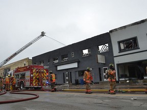 Fire crews continue to pour water on a fire along Hanover's main street late Thursday morning.