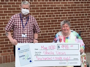 Sheila Voisin took home $998 as the week 2 winner of the Pembroke Regional Hospital Foundation's Catch the Ace 4.0 fundraiising raffle. Presenting the cheque is Roger Martin, executive director of the Foundation. Submitted photo