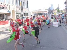 Participants in the 2K event at the Heroes Run for Healthcare dash out from the starting line and head down Pembroke Street West early Saturday morning. Anthony Dixon