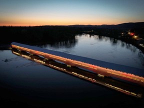 The Felix-Gabriel-Marchand Covered Bridge at Mansfield-et-Pontefract is now illuminated allowing night crossings over the Coulonge River.  Brandon on the Go photo
