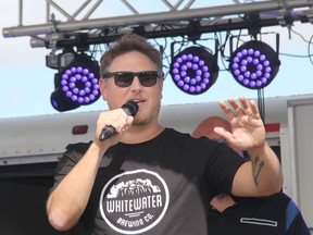 Country music star Jason Blaine addresses the crowd at the start of the 2021 Jason Blaine Celebrity Charity Golf Classic held at the Pembroke Golf Club. Anthony Dixon