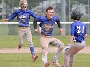 Mitchell Blue Devils players celebrate after a 3-2 walk-off win over Stratford in the Huron-Perth baseball final Friday in Mitchell.