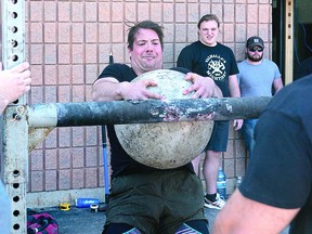 TOUGH COMPETITION Local strongman Brandon Corelli lifts a 220-pound stone in the stone over bar event at the 2022 Valhalla Mightiest competition held at Rebel Gym on Second Line East on Saturday. Corelli finished 5th in the novice heavyweight division. Forty-eight competitors from across the province attended the event which was a qualifier for the Ontario Strongman/Strongwoman Provincial competition to be held in Perth,  on June 18. BOB DAVIES