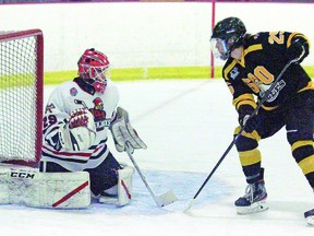 Goalie Kyler Lowden of the Wisconsin Lumberjacks of the Superior International Jr. Hockey League faces a scoring attempt by Zachary Briskey of the Soo Eagles of the Northern Ontario Jr. Hockey League during 2022 inter-league action between the two teams. ROB HORN