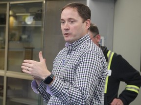 Glenn Hayes, Imperial Oil refinery manager in Sarnia, speaks to visiting community representatives watching closed circuit TV images of Monday's emergency simulation happening at the company's tank farm.