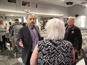 Keith Benn, New Blue Party of Ontario candidate in Sarnia-Lambton, speaks with members of the crowd following a campaign event Saturday at the Sarnia Library Theatre.