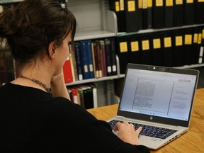 Nicole Aszalos uses the historical newspaper resource now available through Lambton County Library. (Submitted)
