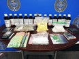 Sarnia police said officers found more than 17 grams of crystal methamphetamine; 236 LSD squares; 17 bottles of promethazine with codeine; nearly 131 grams of magic mushrooms; more than 3,000 benzodiazepines tabs; and about $1,500 in cash during a raid of a Stuart Street on Wednesday, May 11, 2022. (Sarnia police)