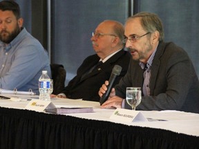 New Blue candidate Keith Benn speaks May 18 at an all candidates forum for the Sarnia-Lambton provincial election riding, hosted by the Sarnia-Lambton Real Estate Board at the Sarnia Golf and Curling Club. Also pictured are NDP candidate Dylan Stelpstra, left, and PC candidate Bob Bailey. (Tyler Kula/ The Observer)