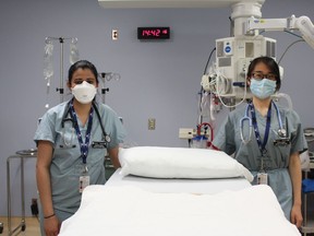 Medical students, from left, Aleena Virani and Cathy Wang are shown in the emergency department at Bluewater Health in Sarnia.