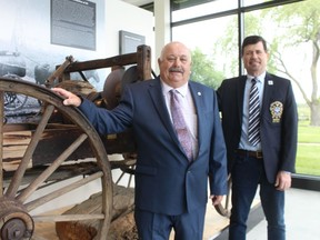 Oil Springs Mayor Ian Veen, left, and Lambton County Warden Kevin Marriott stand in the exhibition hall of the Oil Museum of Canada in Oil Springs. The county held a celebration Friday of the reopening of the museum after more than $1-million in renovations.