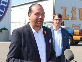 Jason Henry, chief of Kettle and Stony Point First Nation, is shown in this file photo with Monte McNaughton. Henry, a former federal NDP candidate, has endorsed McNaughton, a Progressive Conservative, for re-election June 2.