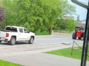 Provincial police released an image of this white pickup truck and red tractor, which were believed to be involved with the theft of three pride flags in Norwich Township.