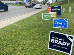 Candidate signs for the June 2 provincial election are placed along the Queensway East in Simcoe. SIMCOE REFORMER PHOTO