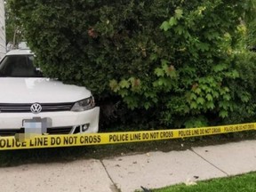 A stolen Volkswagen Jetta that became wedged between a residence and a tree in Owen Sound.