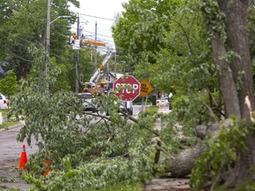 London Hydro crews were still working Sunday morning to clean up the damage caused by a storm that crashed through London Saturday afternoon. Photograph taken on Sunday May 22, 2022. Mike Hensen/The London Free Press