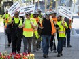 OTTAWA — Striking Carpenters Union members picket along Wellington Street on Wednesday, May. 11, 2022.