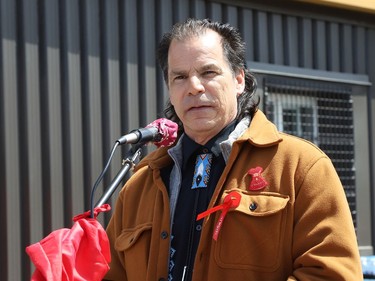 Chief Larry Roque, of the Wahnapitae First Nation, makes a point at a ceremony at the unveiling of the Red Dress Art Reveal at the NÕSwakamok Native Friendship Centre in Sudbury, Ont. on Thursday May 5, 2022. The event was held on the National Day of Awareness for Missing and Murdered Indigenous Women, Girls and Two-Spirit people. The art was created by Kathryn Corbiere, of One Kwe Modern Fabrications, and commissioned through the Looking Ahead to Build the Spirit of Our Women ÐLearning to Live Free from Violence project in collaboration with the NÕSwakamok Native Friendship Centre. John Lappa/Sudbury Star/Postmedia Network