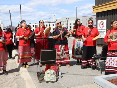 Anishnaabe Kweok Singers perform at a ceremony at the unveiling of the Red Dress Art Reveal at the NÕSwakamok Native Friendship Centre in Sudbury, Ont. on Thursday May 5, 2022. The event was held on the National Day of Awareness for Missing and Murdered Indigenous Women, Girls and Two-Spirit people. The art was created by Kathryn Corbiere, of One Kwe Modern Fabrications, and commissioned through the Looking Ahead to Build the Spirit of Our Women ÐLearning to Live Free from Violence project in collaboration with the NÕSwakamok Native Friendship Centre. John Lappa/Sudbury Star/Postmedia Network