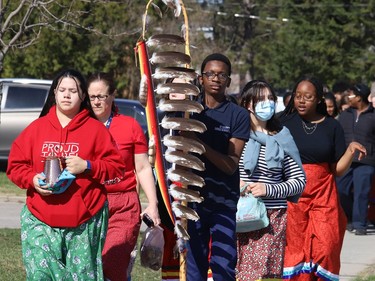 St Benedict Catholic Secondary School students and staff take part in a Water Walk in Sudbury, Ont. on Thursday May 5, 2022. The Diversity Club at the school organized the event with Indigenous support lead Shannon Agowissa. The walk, which was held during Mental Health Week, was also held to recognize National Day of Awareness for Missing and Murdered Indigenous Women, Girls and Two-Spirit people. John Lappa/Sudbury Star/Postmedia Network