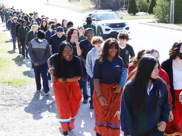 St Benedict Catholic Secondary School students and staff take part in a Water Walk in Sudbury, Ont. on Thursday May 5, 2022. The Diversity Club at the school organized the event with Indigenous support lead Shannon Agowissa. The walk, which was held during Mental Health Week, was also held to recognize National Day of Awareness for Missing and Murdered Indigenous Women, Girls and Two-Spirit people. John Lappa/Sudbury Star/Postmedia Network