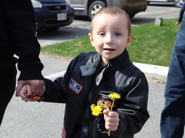 Four-year-old Jackson Twain was all smiles on Wednesday May 11, 2022, when he took part in a classic car parade, and he visited the Lorne Street Dairy Queen where he learned to make ice cream cones. He then visited members of the Greater Sudbury Police and rode in a fire truck while visiting the downtown fire station in Sudbury, Ont. John Lappa/Sudbury Star/Postmedia Network