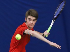 Olivier de la Riva, of College Notre-Dame, returns the ball during the boys high school singles final at the tennis bubble in Sudbury, Ont. on Thursday May 12, 2022. John Lappa/Sudbury Star/Postmedia Network