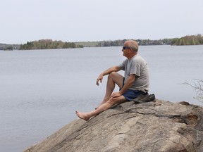 Gerry Pauze takes in the sunshine while enjoying the scenery at Ramsey Lake in Sudbury, Ont. on Thursday May 12, 2022. Environment Canada said Greater Sudbury can expect another beautiful day with sunny skies and a high of 30 C. John Lappa/Sudbury Star/Postmedia Network