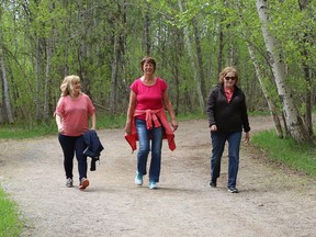 Diane Dalcourt, left, Theresa Dalcourt and Pat Ireland walk one of the trails at Fielding Memorial Park in Greater Sudbury, Ontario.  on Monday May 16, 2022. John Lappa/Sudbury Star/Postmedia Network