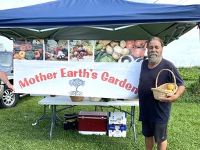 A happy Manitoulin market gardener who loves his vegetables, Ray Bernstein, at Mother Earth's Garden outside Little Current on Highway 540. Bonnie Kogos/For The Sudbury Star.
