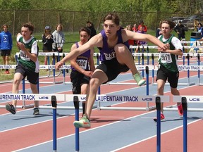 Athletes compete in a junior boys 100 metre hurdles heat at the high school track and field championship at the Laurentian Community Track in Sudbury, Ont. on Wednesday May 18, 2022.