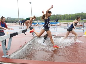 Athletes compete in the girls open 2,000 metre steeplechase final at the high school track and field championship at the Laurentian Community Track in Sudbury, Ont. on Thursday May 19, 2022. John Lappa/Sudbury Star/Postmedia Network