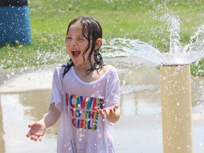 Emma Lacelle, 7, cools off at the splash pad at Victory Park in Sudbury, Ont. on Tuesday May 31, 2022.