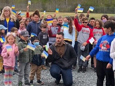 Students and staff of École Jean-Paul II (Val Caron) gathered on May 17 on the school grounds during a rally to celebrate the success of a fundraising campaign in support of the victims of the ongoing war in Ukraine. This activity, highlighting the importance of human solidarity, included the presentation of a donation worth $2,030.25 to the Relief Fund for the Humanitarian Crisis in Ukraine to Louise Trudel of the Canadian Red Cross. This donation was made possible following a fundraiser by the school's Val Coeurons Club in April. Grade 7 and 8 students were affected by the war in Ukraine and wanted to help the victims. Students coordinated the sale and distribution of coco-grams (small chocolate) among students and school staff for $1. Supplied