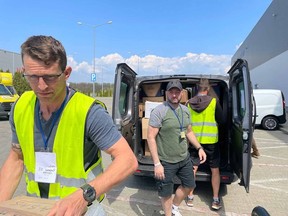 Johnathan Verroen, from the Sarnia area, centre, has been volunteering in Poland and Ukraine to help refugees seeking to come to Canada.
Handout