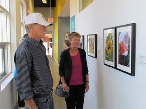Judith and Alix Norman Art Gallery patrons take a gander at photos created by local teens as part of the Take Your Shot: Teen Photo Contest in 2019. Handout/Sarnia This Week