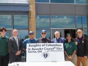 A barbecue fundraiser at St. Patrick's Catholic High School raised over $2,000 for Ukrainian relief efforts and refugees. From left to right: St. Pat's student Marcus Bastien, Director of Education Scott Johnson, Knights of Columbus members Don Melanson and Leo Mayer, Sarnia Bluewater Roman Catholic Family of Parishes' Father Dan Vere, St. Pat's student Pavi Padmananthan and Knights of Columbus member Bob Fleming. 
Handout/Sarnia This Week