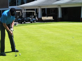 A golfer sinks a putt at the Sarnia Golf & Curling Club's practice green in this file photo from 2020. The club will play host to the 2022 Ontario Men's Senior Championship from July 25 to 27. 
File photo/Postmedia Network