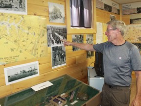 Plympton-Wyoming Historical Society president Gordon Mackenzie points to a picture in an exhibition at the Plympton-Wyoming Museum. After a two-plus year Covid-related closure, the museum will once again be open to the public on June 11. 
File photo/Postmedia Network