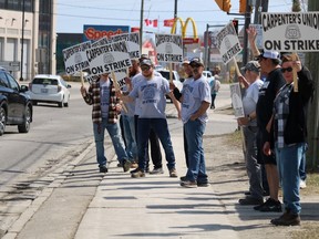 Dozens of local carpenters and tradespeople gathered at the intersection of Algonquin Boulevard East and Brunette Road in Timmins on Monday morning as an estimated 15,000 workers represented by the Carpenters District Council of Ontario are now on strike across the province.

ANDREW AUTIO/The Daily Press