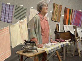 Sylvia Martin, who founded the Porcupine Handweavers and Spinners Guild 45 years ago, speaks at the the opening for "A Treasury of Textiles," at the Timmins Museum on Thursday. Martin shared that she keeps in touch with former guild members who are now all over Canada, and still making textiles.

NICOLE STOFFMAN/The Daily Press