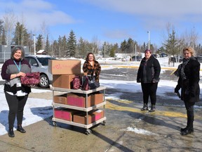 Three local independent consultants of Thirty–One, a direct-selling organization, recently donated gifts to oncology patients receiving treatment at Timmins and District Hospital. Attending the donation, from left, Barb McCormick of TADH Foundation, Jodi Lachance, Sheri Beaudin and Carrie Sullivan.

Supplied