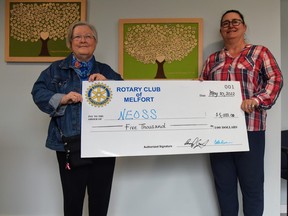 Gailmarie Anderson presenting a cheque on behalf of the Rotary Club of Melfort to Louise Schweitzer, the executive director with NEOSS, Omar Sherif / The Journal