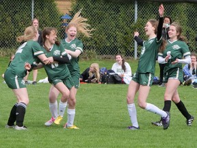 Glendale Gemini girls rush to congratulate shootout scorer Hailey Breddy, the seventh shooter in the Gemini Cup fourth place final. Breddy's 'bardown' goal gave Tillsonburg a 3-2 win over Woodstock Collegiate Friday afternoon. CHRIS ABBOTT Norfolk and Tillsonburg News